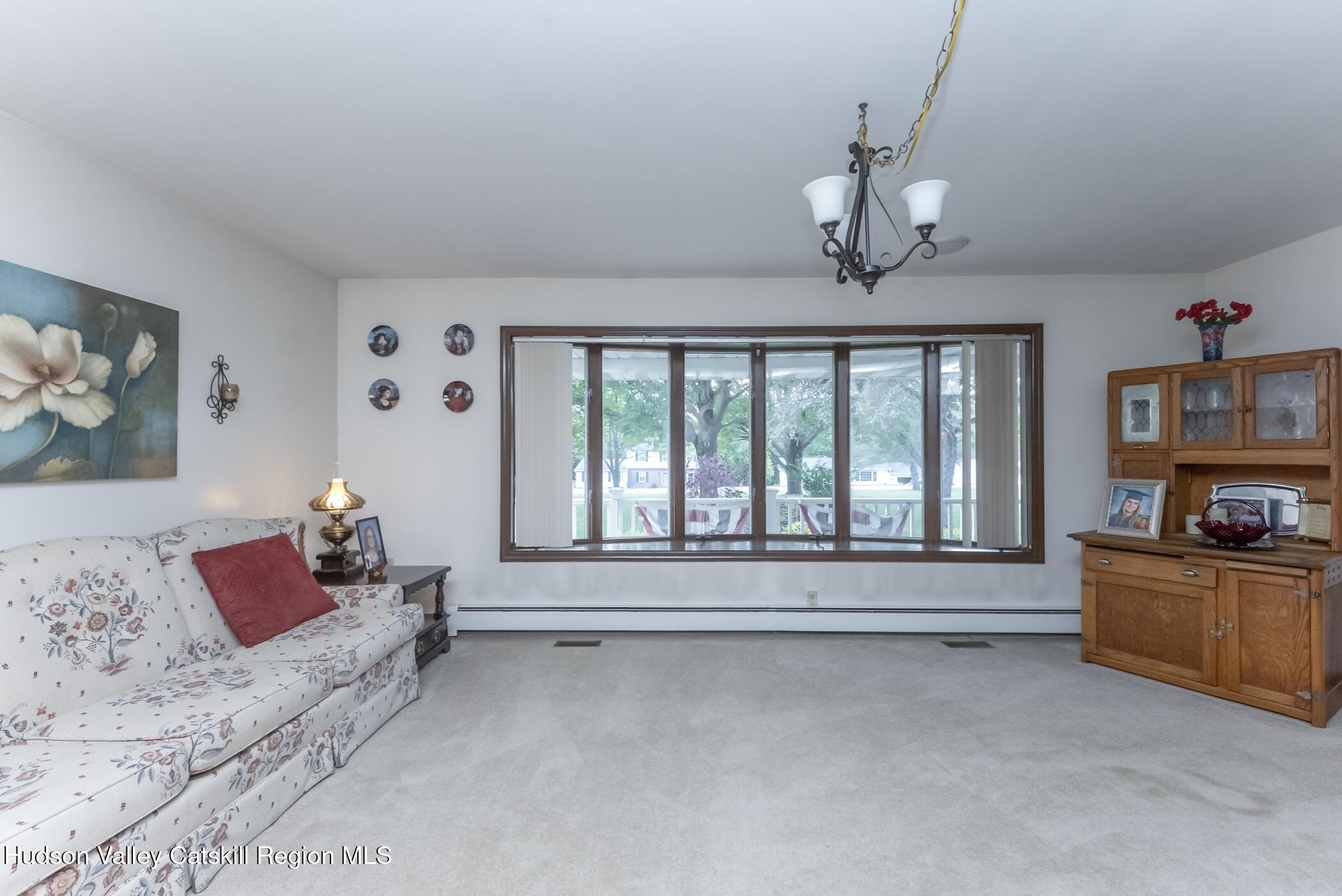 135 Hilltop Road Saugerties, NY 12477 - Photo 9 of 49 a living room with furniture and a flat screen tv