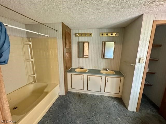 267 Stable Road Lagrange, OH 44050 - Photo 10 of 10 Bathroom featuring tile floors, a textured ceiling, shower / bath combination, and dual vanity