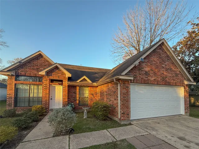 a front view of a house with garage