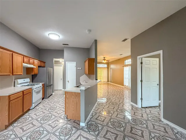 a large bathroom with a large mirror vanity and shower