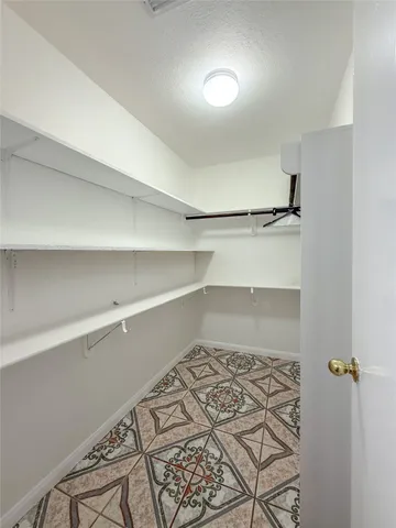 a view of a room with racks on the wall