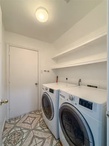 a view of a storage & utility room with washer and dryer