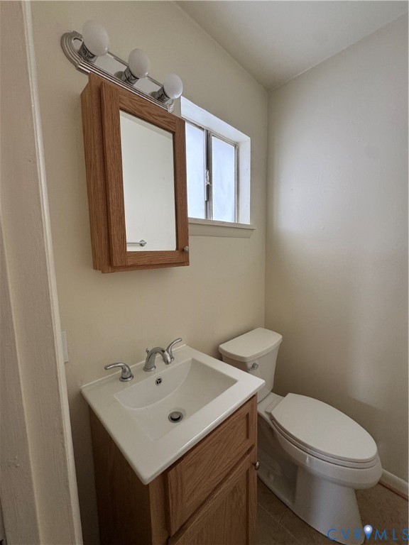 419 Roxana Road Henrico, VA 23075 - Photo 13 of 17 Bathroom featuring a wood-finish vanity with an in