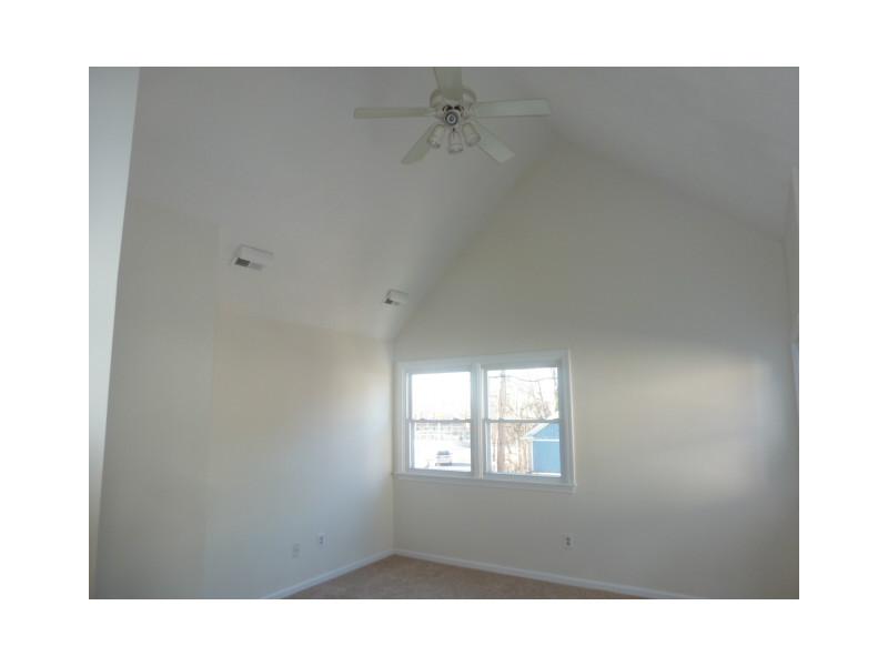 19 Spring Street, Unit B1 Pawtucket, RI 02860 - Photo 9 of 14 Master Bedroom. Vaulted Ceiling - 2 closets Freshly Painted