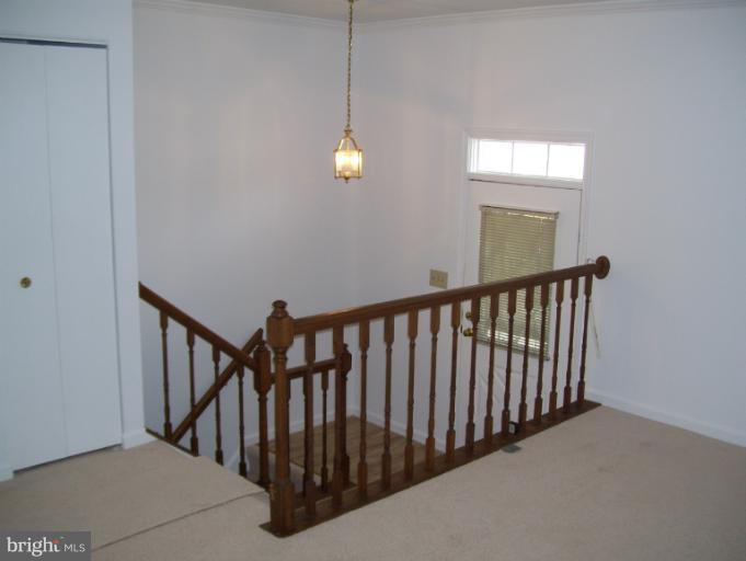 14432 Bakersfield Court Silver Spring, MD 20906 - Photo 1 of 11 a view of staircase with railing and a chandelier