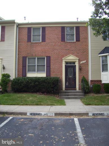 14432 Bakersfield Court Silver Spring, MD 20906 - Photo 11 of 11 a front view of a house with garden