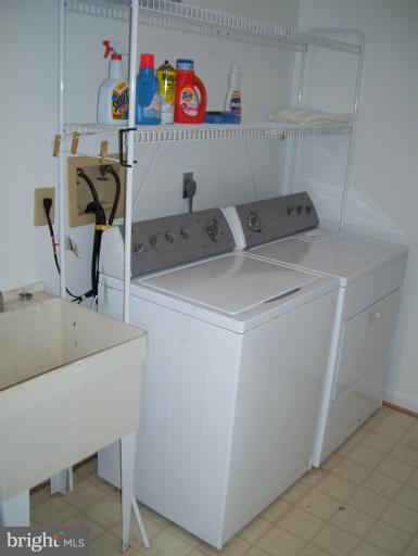 14432 Bakersfield Court Silver Spring, MD 20906 - Photo 10 of 11 a utility room with dryer and washer