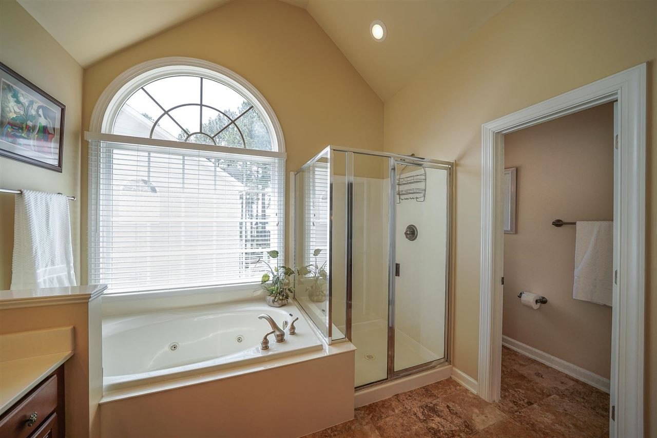 6000 Tiffield Way Wake Forest, NC 27587 - Photo 21 of 30 Large Owner's Bathroom with vaulted ceiling, tile floors, large double vanity, JETTED bathtub, separate shower and private toilet. Owner's Bath