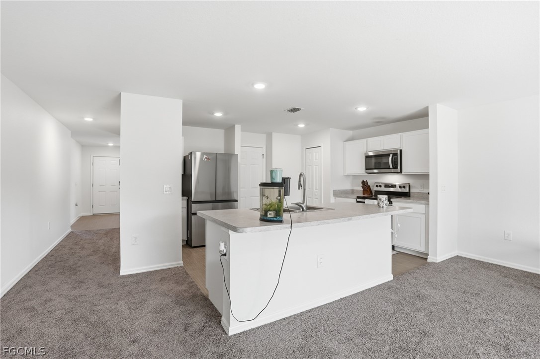 3319 40th Street West Lehigh Acres, FL 33971 - Photo 14 of 45 a view of kitchen with refrigerator sink and microwave