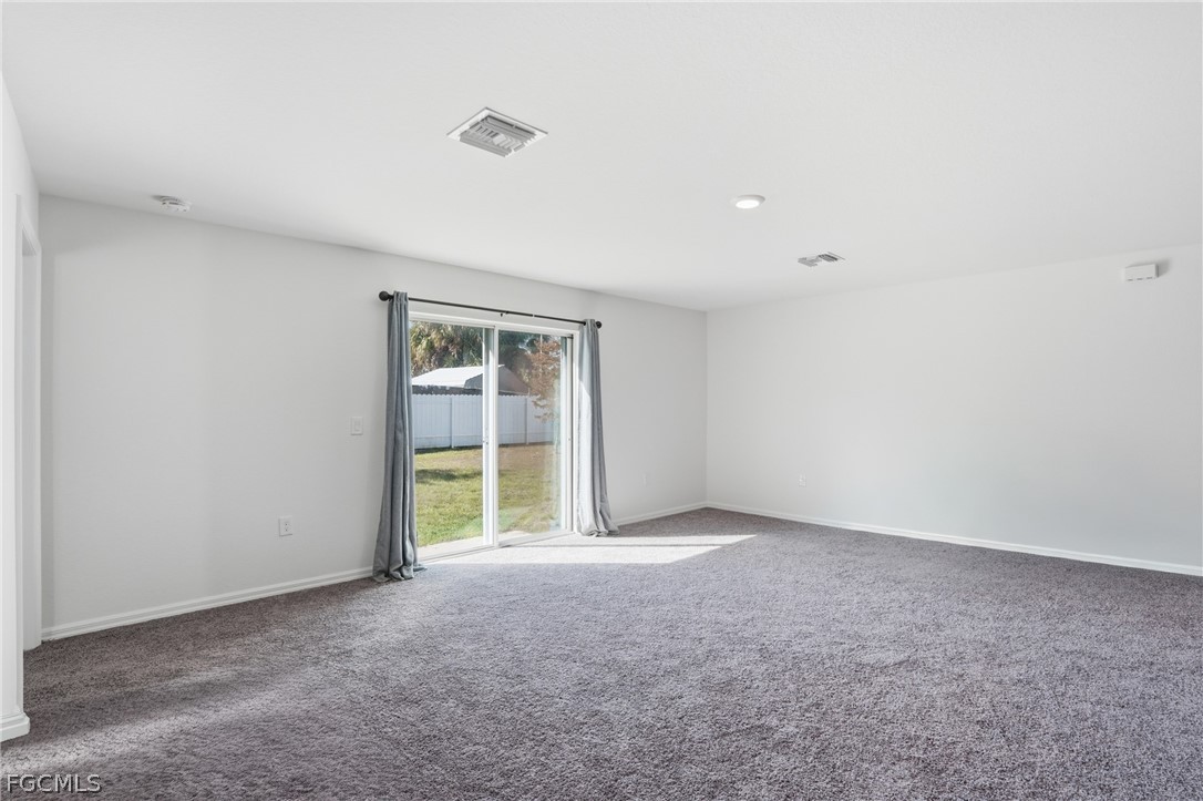 3319 40th Street West Lehigh Acres, FL 33971 - Photo 16 of 45 a view of an empty room with a window