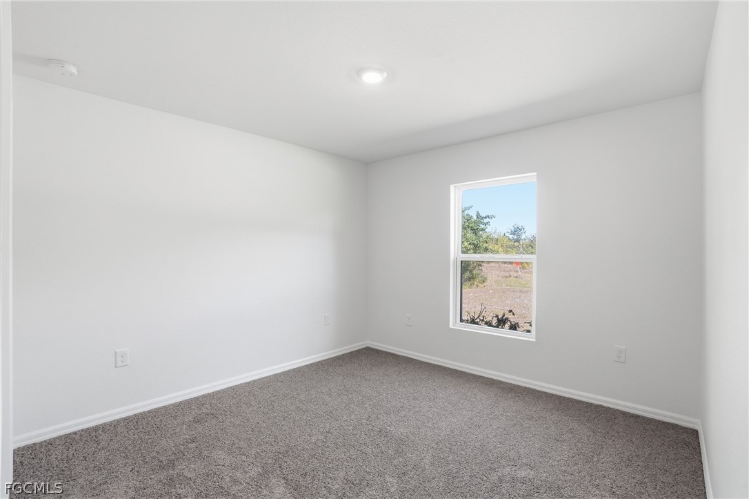3319 40th Street West Lehigh Acres, FL 33971 - Photo 21 of 45 an empty room with windows