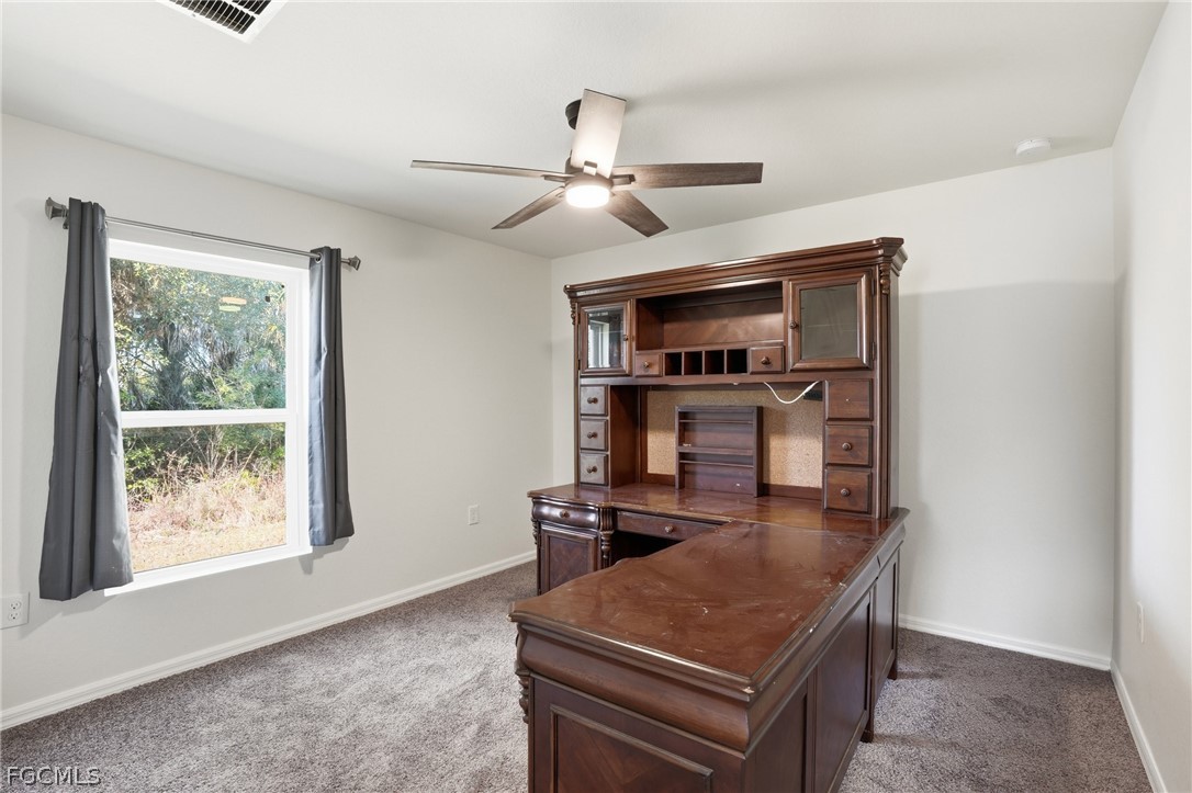 3319 40th Street West Lehigh Acres, FL 33971 - Photo 26 of 45 a room with furniture and window