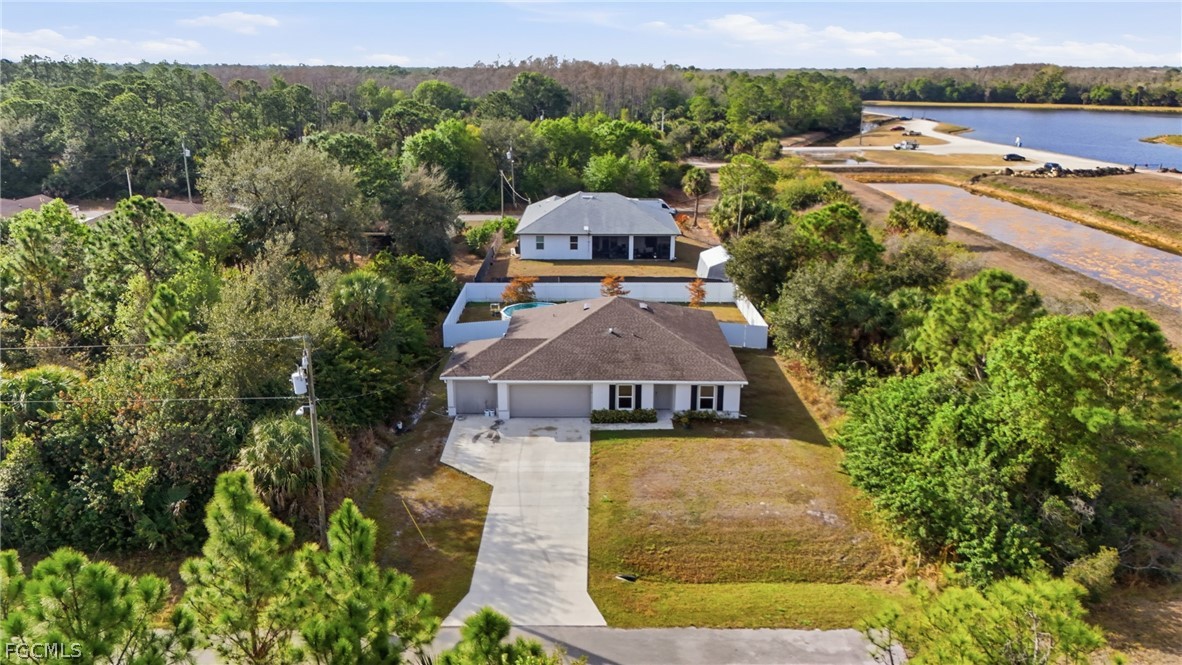 3319 40th Street West Lehigh Acres, FL 33971 - Photo 33 of 45 an aerial view of a house with swimming pool
