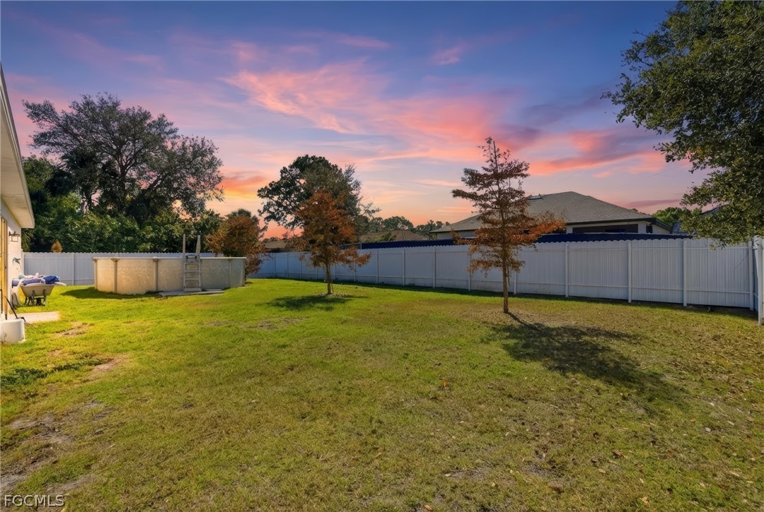 3319 40th Street West Lehigh Acres, FL 33971 - Photo 37 of 45 a view of back yard of the house