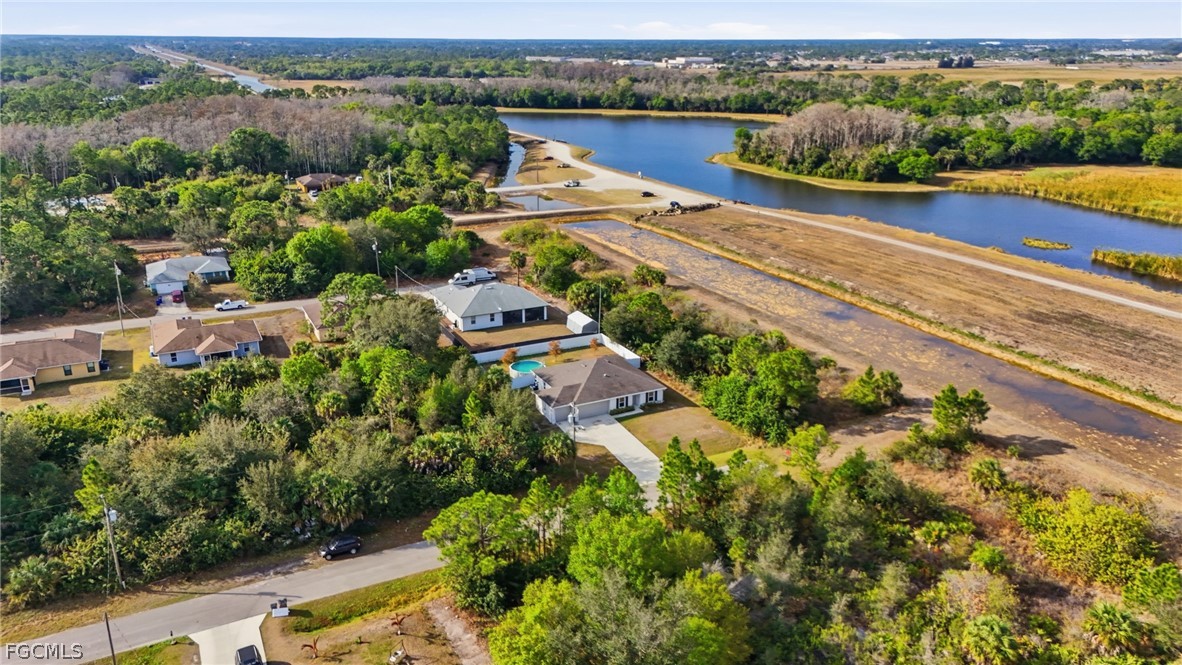 3319 40th Street West Lehigh Acres, FL 33971 - Photo 41 of 45 an aerial view of a house with a garden