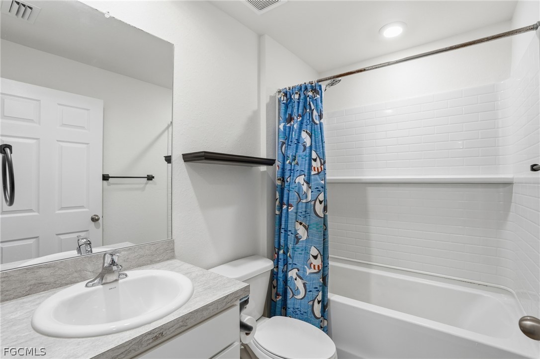 3319 40th Street West Lehigh Acres, FL 33971 - Photo 10 of 45 a bathroom with a sink toilet and shower