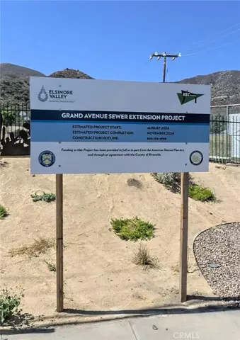 a view of a street with a building in the background