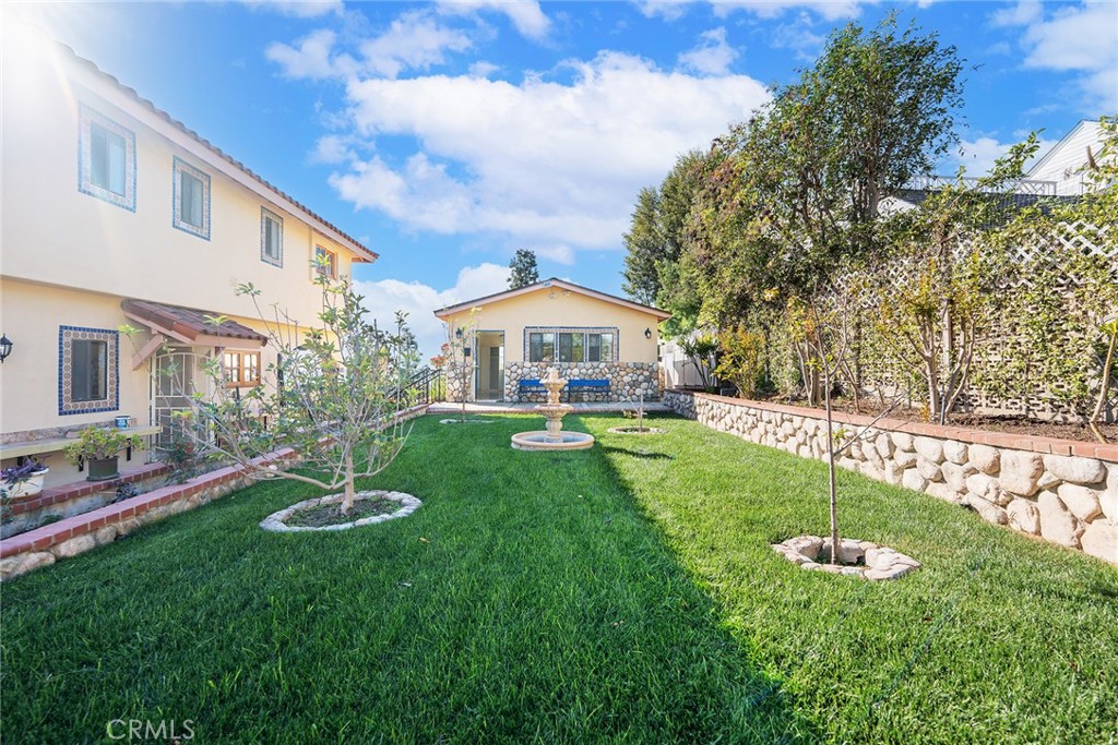 2240 Foothill Boulevard Santa Ana, CA 92705 - Photo 15 of 31 a swimming pool with lots of tress in front of it