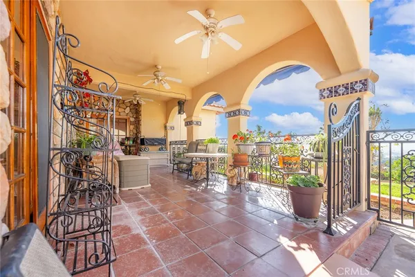 a view of a chairs and table in a patio