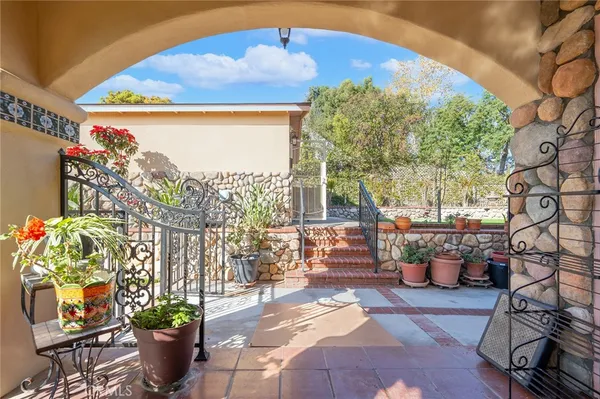 a view of a chairs and table in a patio