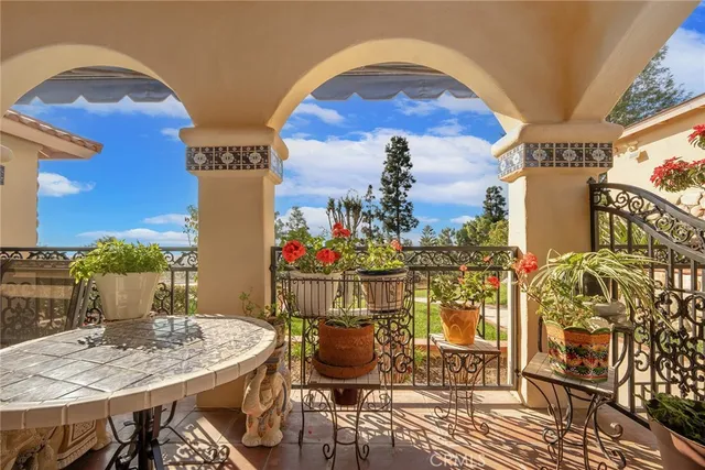 a view of a tables and chairs on the roof deck