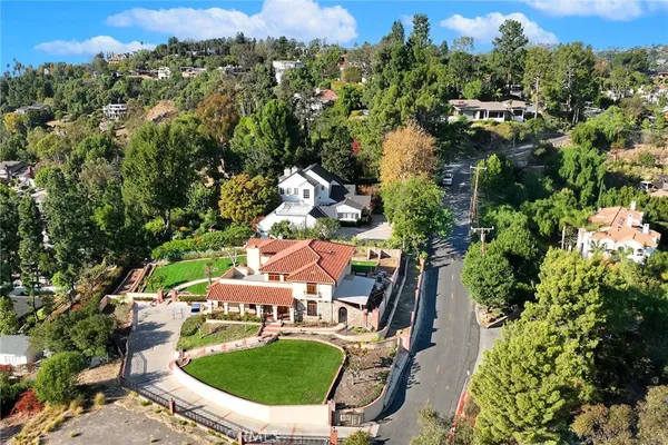 an aerial view of house with yard swimming pool and outdoor seating