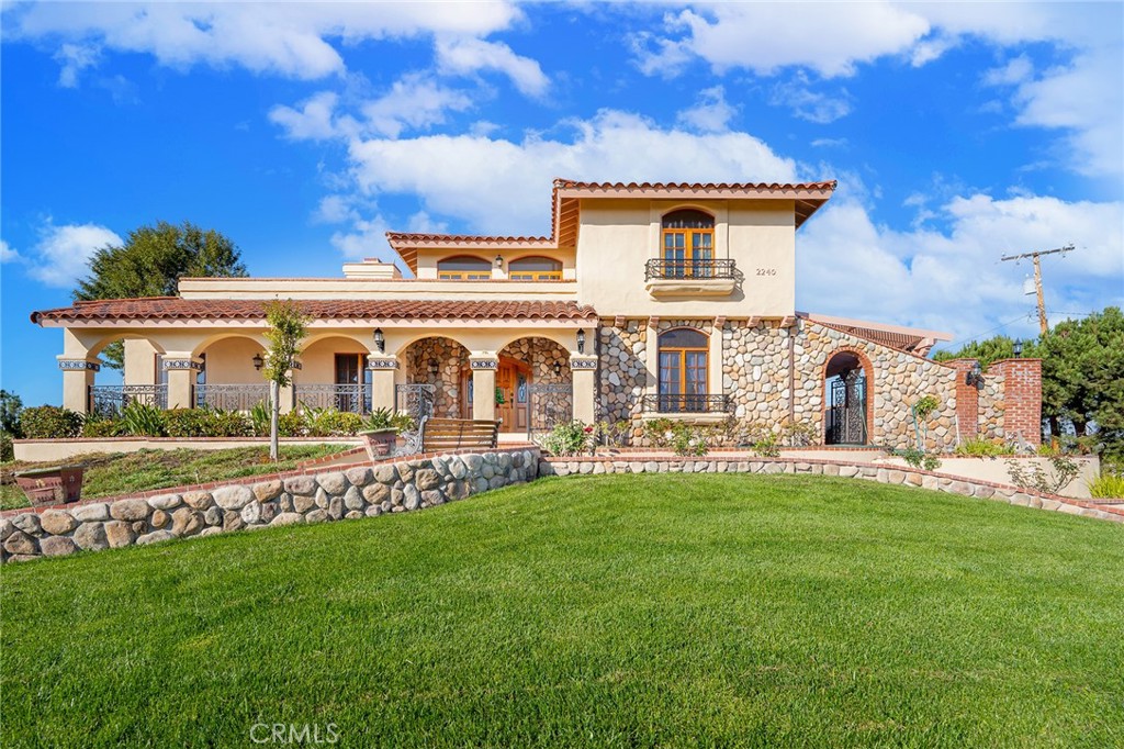 2240 Foothill Boulevard Santa Ana, CA 92705 - Photo 5 of 31 front view of a house with a yard