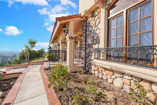 a view of a brick building next to a yard