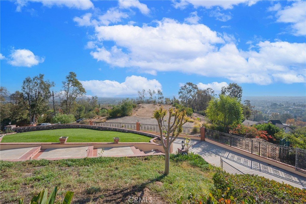 2240 Foothill Boulevard Santa Ana, CA 92705 - Photo 10 of 31 a view of a swimming pool with a yard