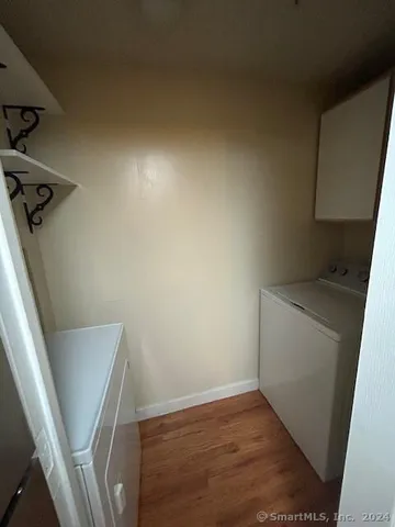 a view of a storage & utility room with a washer dryer