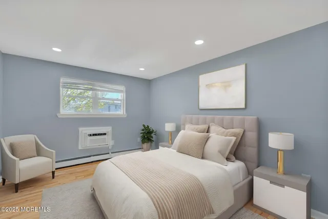 a bedroom with a bed and a couch