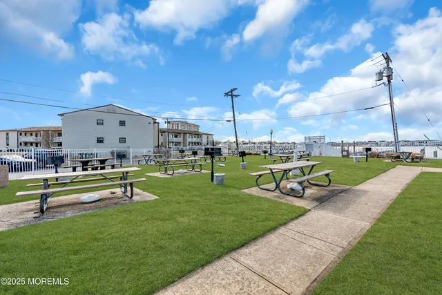 a view of a garden with sitting area