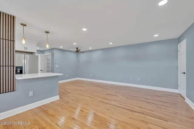 a view of kitchen with wooden floor