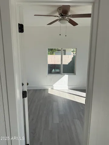 a view of an empty room with a window