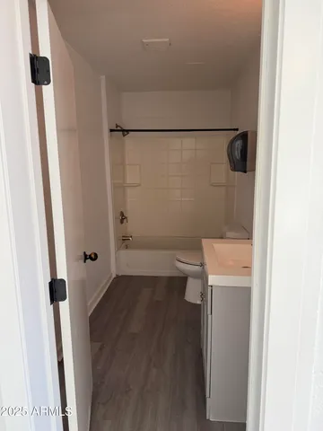 a bathroom with a sink and toilet
