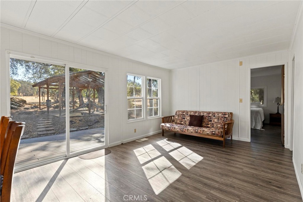 75 Obert Drive Bangor, CA 95914 - Photo 16 of 52 a living room with furniture and a floor to ceiling window