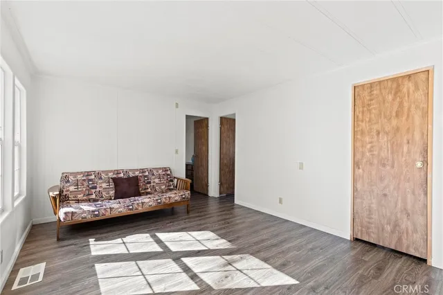 a living room with a couch and a rug
