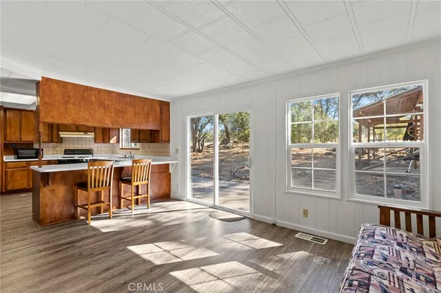 a view of kitchen with furniture and window