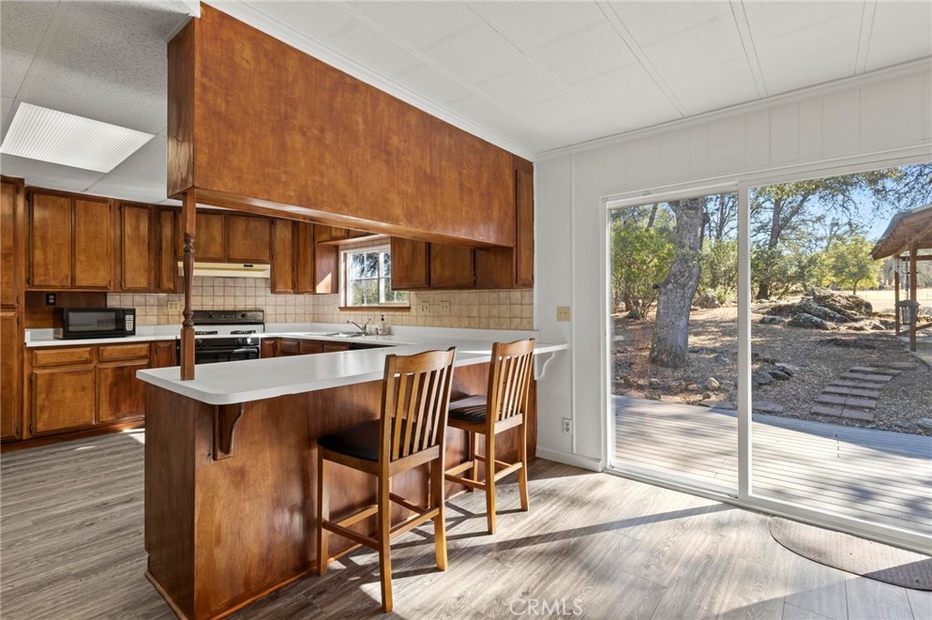 75 Obert Drive Bangor, CA 95914 - Photo 19 of 52 a kitchen with a stove a sink and a refrigerator