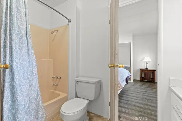 a bathroom with a toilet a sink and a shower