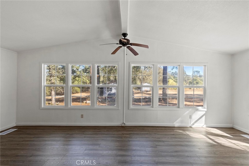 75 Obert Drive Bangor, CA 95914 - Photo 6 of 52 a view of wooden floor and a chandelier fan in a room