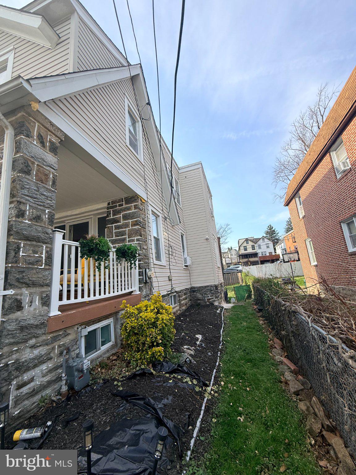 4027 Vernon Road Drexel Hill, PA 19026 - Photo 2 of 19 Charming side yard with greenery.