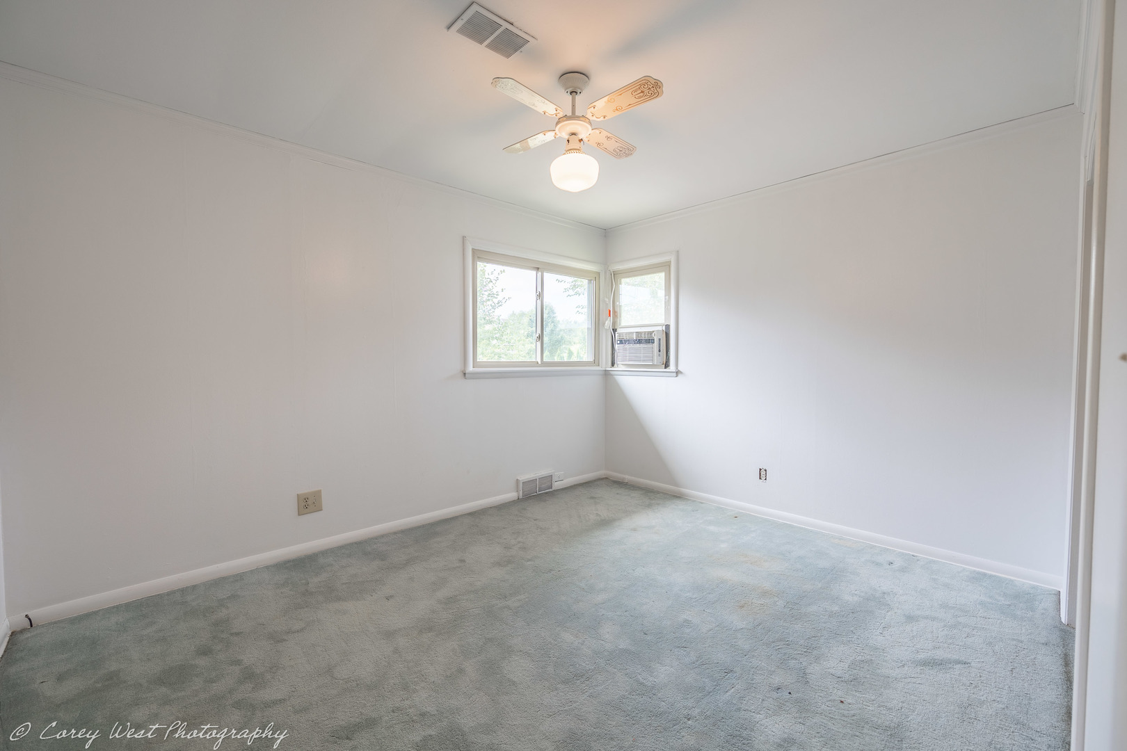 1233 Wild Street Sycamore, IL 60178 - Photo 12 of 18 an empty room with windows and chandelier fan