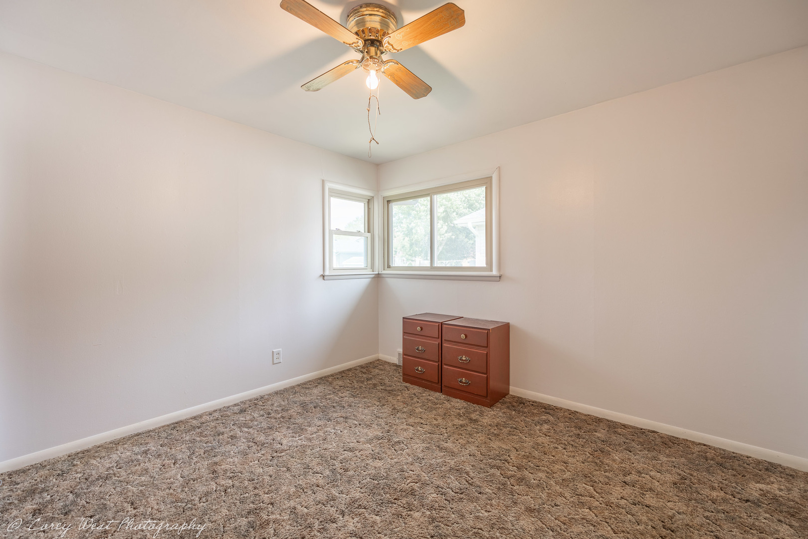 1233 Wild Street Sycamore, IL 60178 - Photo 14 of 18 an empty room with windows and fan