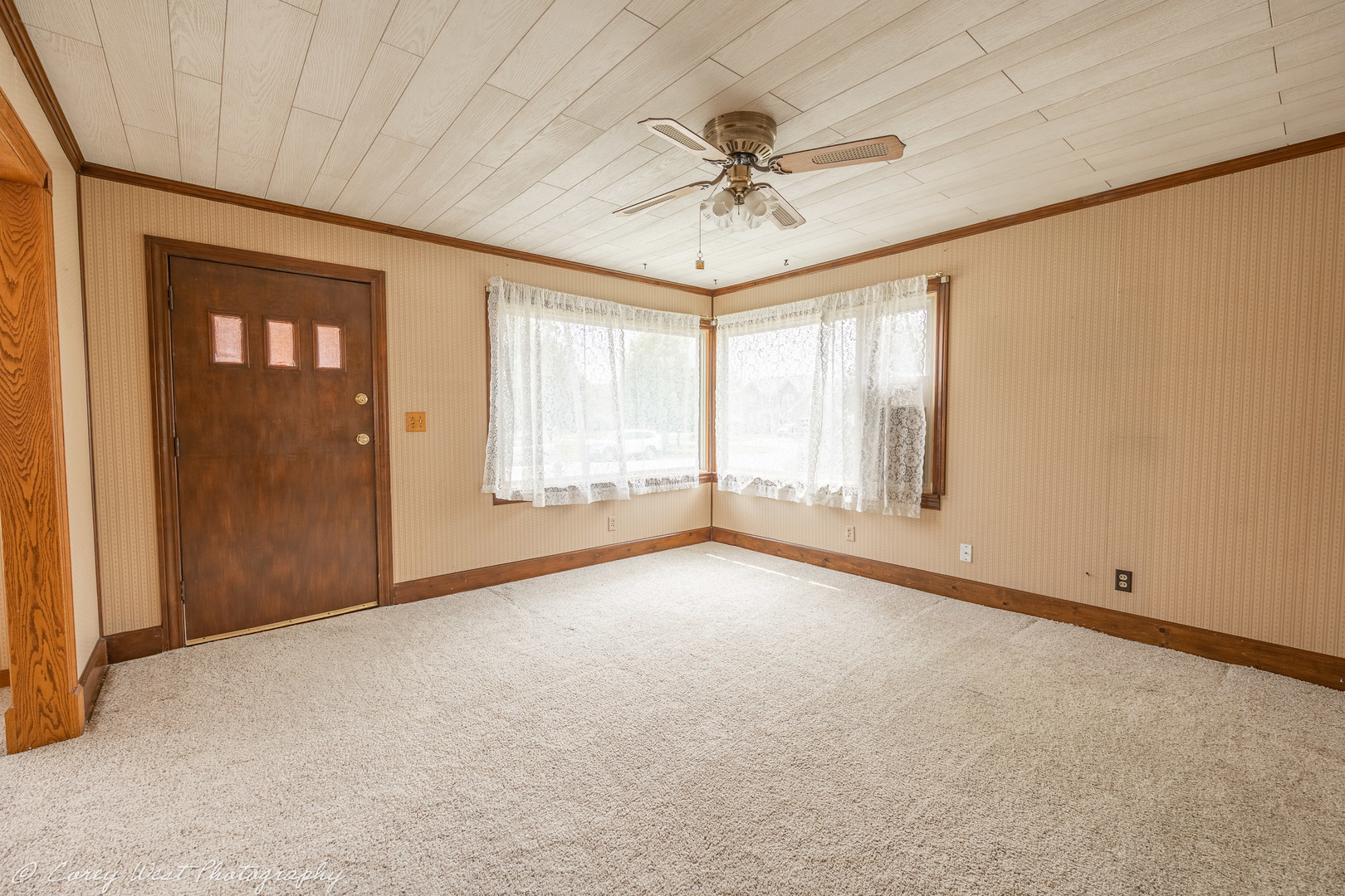 1233 Wild Street Sycamore, IL 60178 - Photo 2 of 18 an empty room with windows and fan