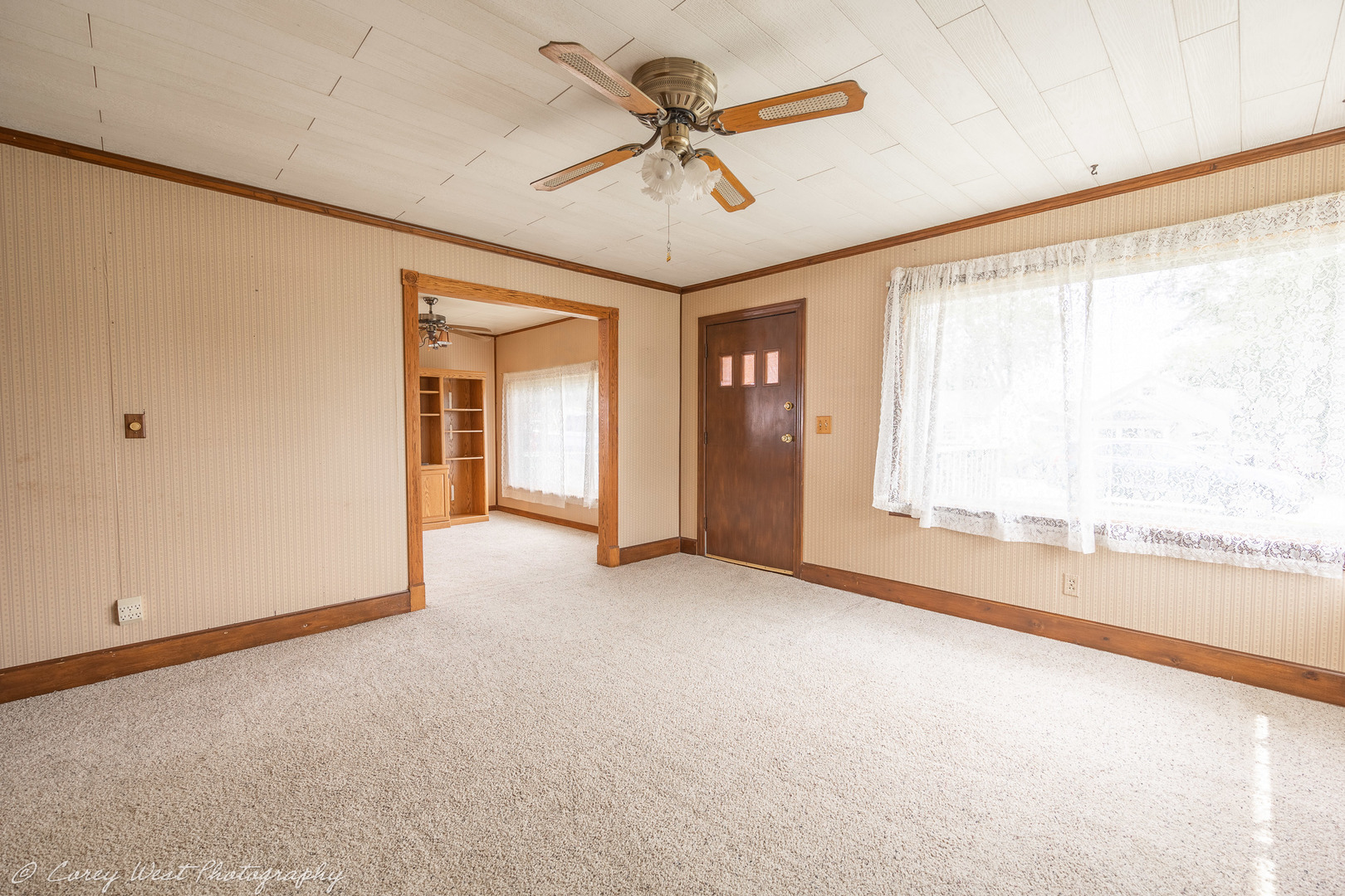 1233 Wild Street Sycamore, IL 60178 - Photo 3 of 18 an empty room with chandelier fan and windows