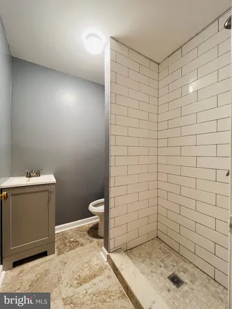 a bathroom with a sink and a toilet