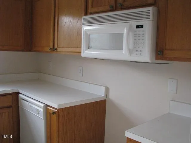 a white refrigerator freezer sitting in a kitchen