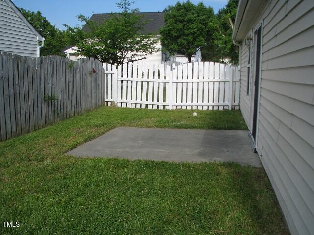 4419 Nightfall Court Durham, NC 27713 - Photo 14 of 17 a view of a yard with wooden fence
