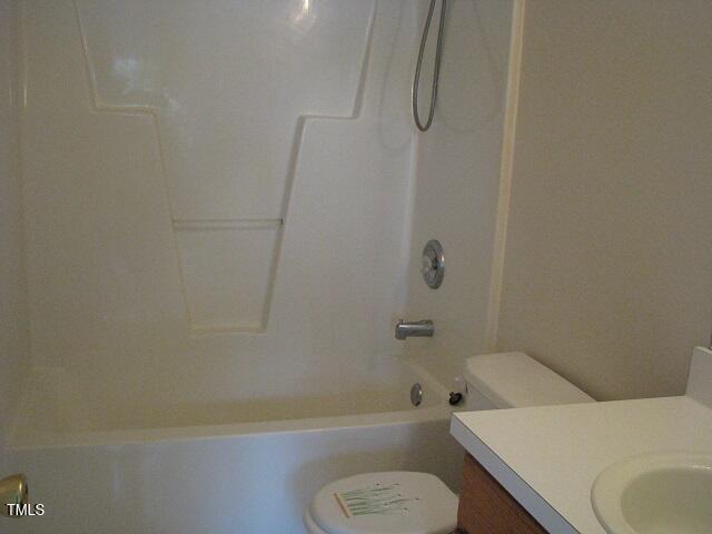 4419 Nightfall Court Durham, NC 27713 - Photo 16 of 17 a bathroom with a toilet and a bath tub